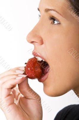 Bitting into a strawberry