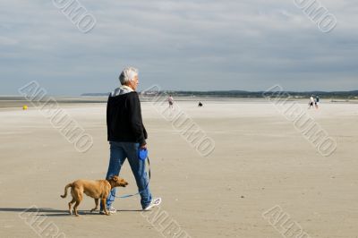 Senior man is walking his dog
