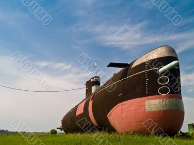 Submarine on green field