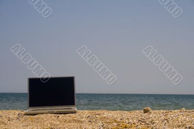 Laptop on beach