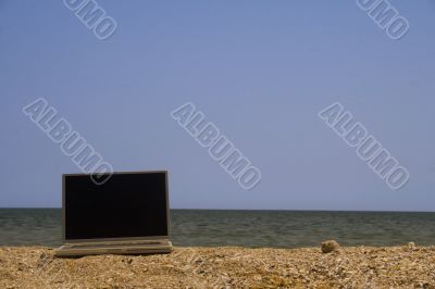Laptop on beach