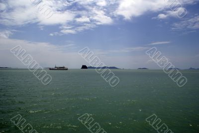 Green sea and ferry