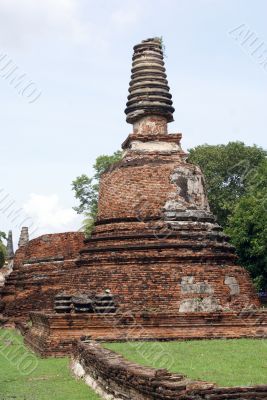 Red stupa and greem grass