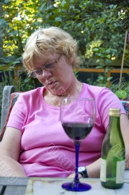 elderly woman falling a sleep after drinking wine