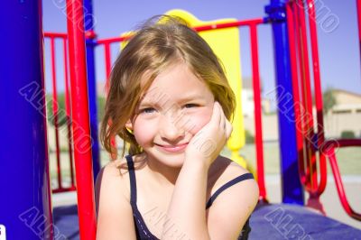 Smiling six year old girl at playground