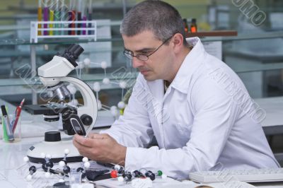 Researcher checking his mobile phone