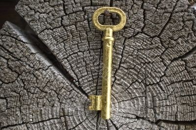 Old key of gold colour.