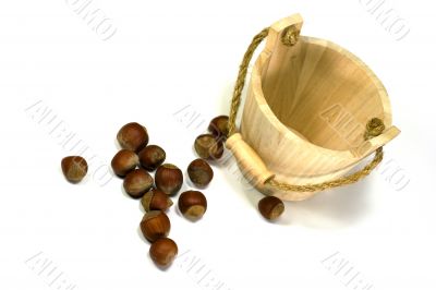 hazelnuts and empty wooden busket