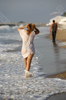 Woman and man at coastline