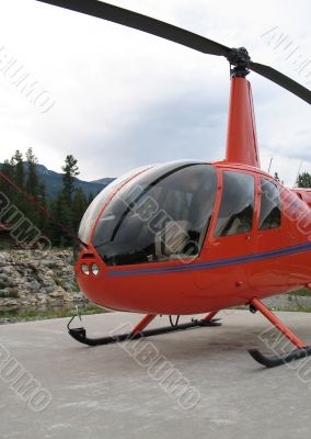 parked orange helicopter