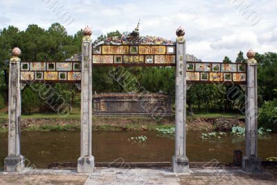Gate, wall and pond