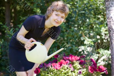 woman watering flowers