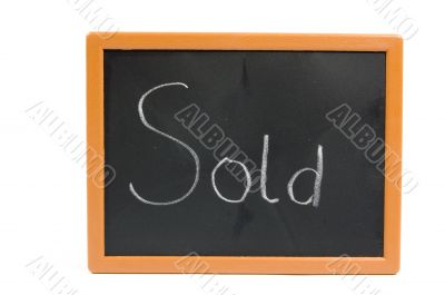 chalkboard with the text sold