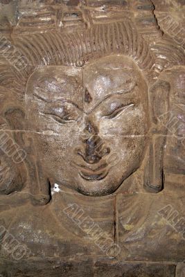 Wall and face of Buddha