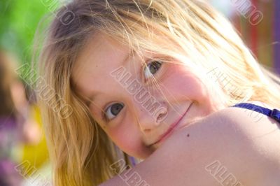 Smiling six year old girl at playground