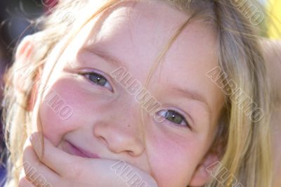 Smiling six year old girl at playground
