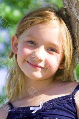 Smiling six year old girl at playground