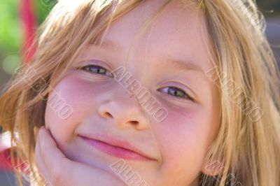 Smiling six year old girl at playground