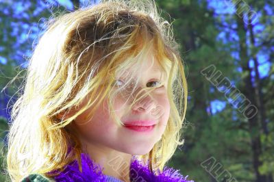 Smiling six year old girl at playground