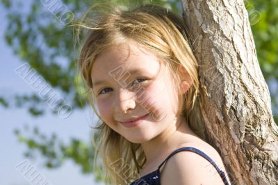 Smiling six year old girl at playground