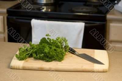 Food on a cutting board with chef`s knife