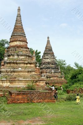Brick stupas and green grass