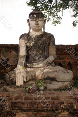 Buddha on the brick wall in Inwa, Mandalay, Myanmar