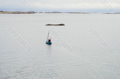 Solo sailor in small boat
