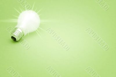 Background with lit lightbulb