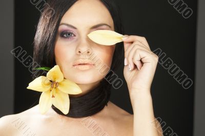 brunette girl posing on dark background