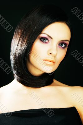 brunette girl posing on dark background