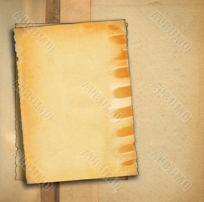 pieces of old paper against stained dirty background