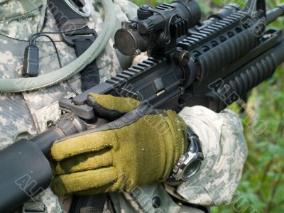 Soldier holding his rifle