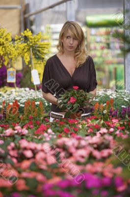 Beautiful blond in gardencenter