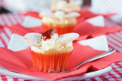 Delicious cupcake with whipped cream