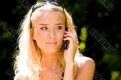 Blond woman talking on mobile phone