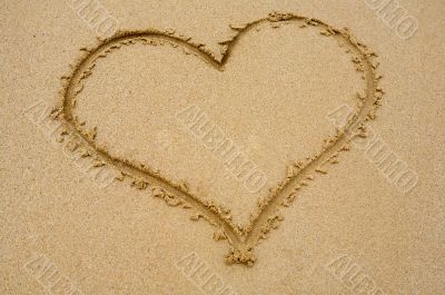 Heart drawn on sand