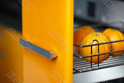 Orange in kitchen in fridge