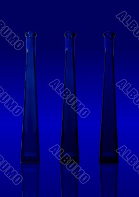 Three blue isolated bottles on blue background