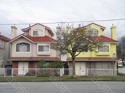 twin houses painted with different colors