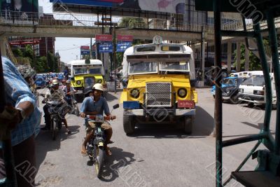 Buses and bike on the street