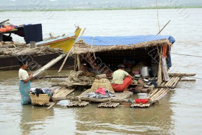 Women and houseboat in Mandalay