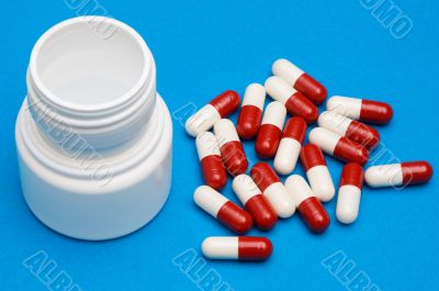 Pills over blue background