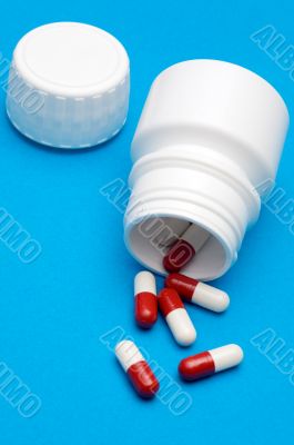 Pills over blue background
