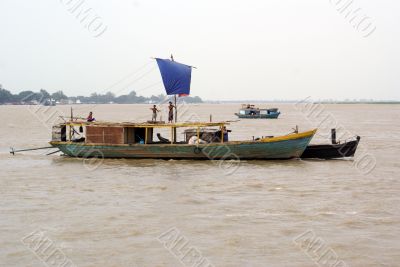 Motor boat with sail