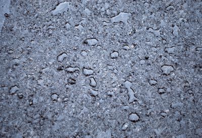 drops of rain water on a fresh asphalt