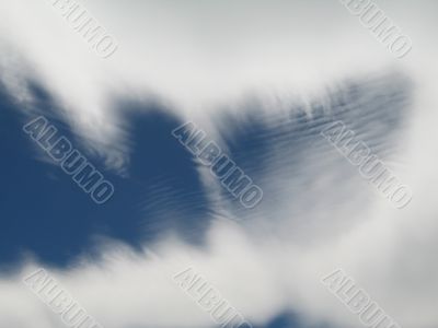 moving clouds shaped like a mouth