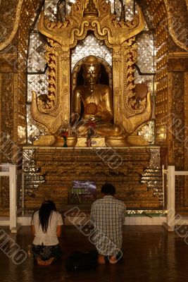 Man and women near Buddha