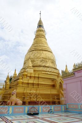 Golden stupa and pink wall