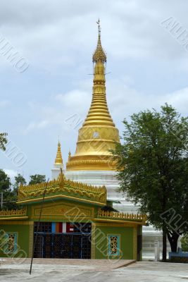 Golden stupa and green temple